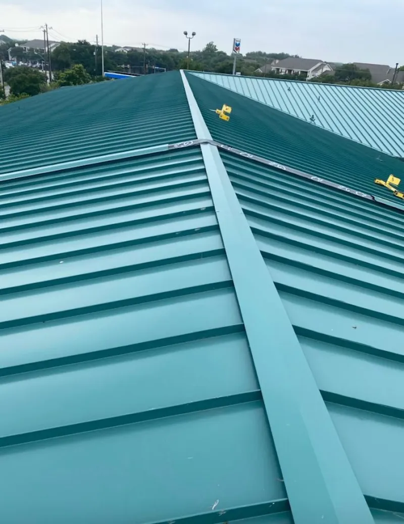 Green commercial metal roof ridge and valley for Metal Roof Repair in West Goshen